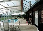 pool enclosure next to a wall