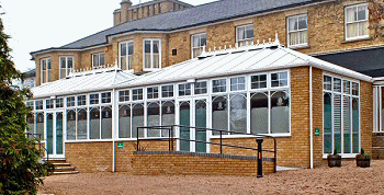 double-hipped Edwardian Style Roof connected via a T-shaped box gutter